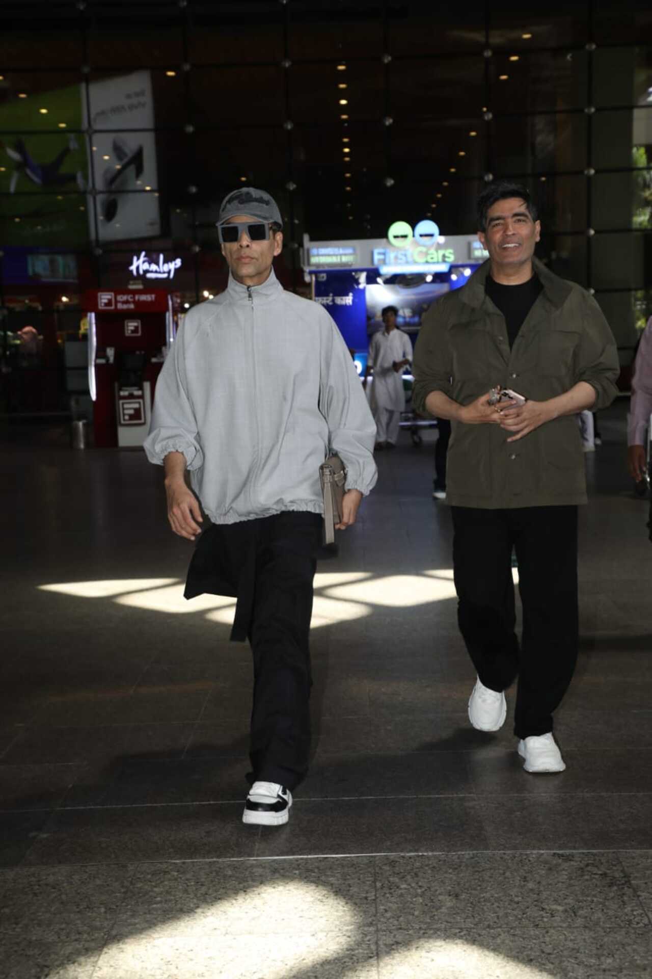Filmmaker Karan Johar and designer Manish Malhotra were spotted together at the airport as they were papped arriving in the city.